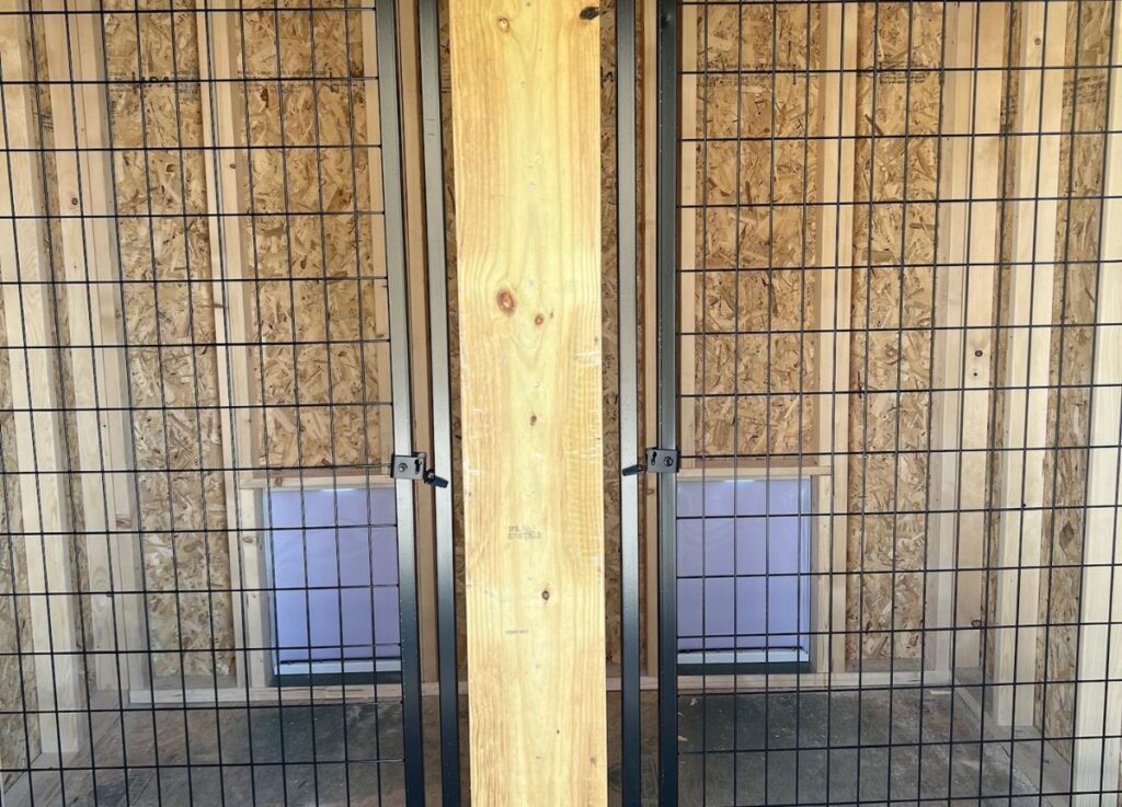 Divided runs inside a dog kennel
