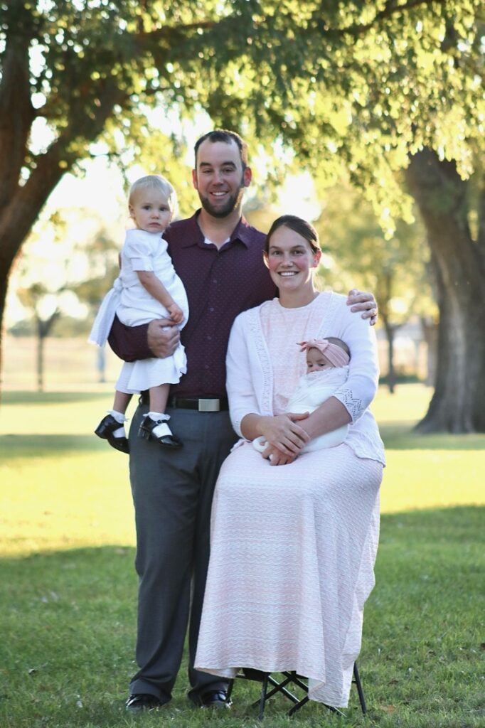 Jalon and Kayla Yoder, owners of Sunflower Sheds, with their two daughters