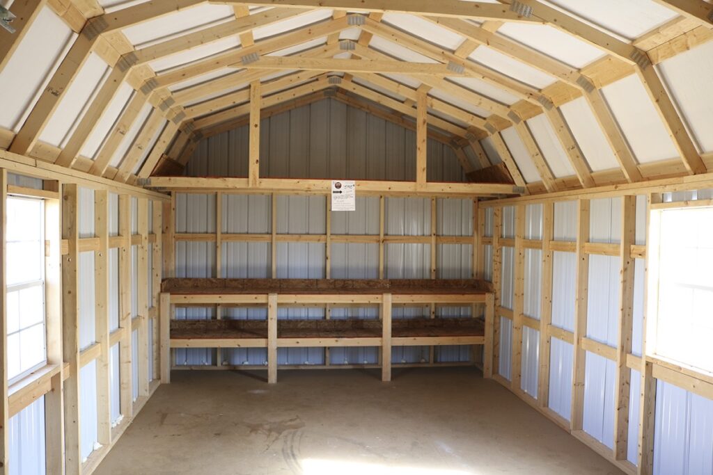 Inside a lofted barn showing the 4 foot storage lofts in each gable end