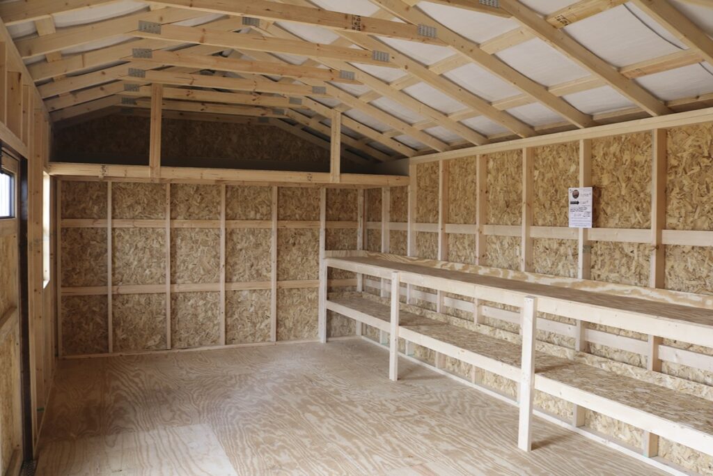 Work benches built along the inside wall of a shed